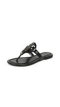 
                        
                          將圖片載入圖庫檢視器 Tory Burch Women's Miller Leather Laser Cut T-Strap Thong Sandal - JOY2ESpree
                        
                      