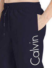 
                        
                          Cargar imagen en el visor de la galería, Calvin Klein Men's 7 Inch Elastic Waist Quick Dry Swim Trunk
                        
                      