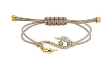 
                        
                          Load image into Gallery viewer, SWAROVSKI Women's Power Collection S Hook Swan Cord Band Crystal Bracelet Collection - JOY2ESpree
                        
                      